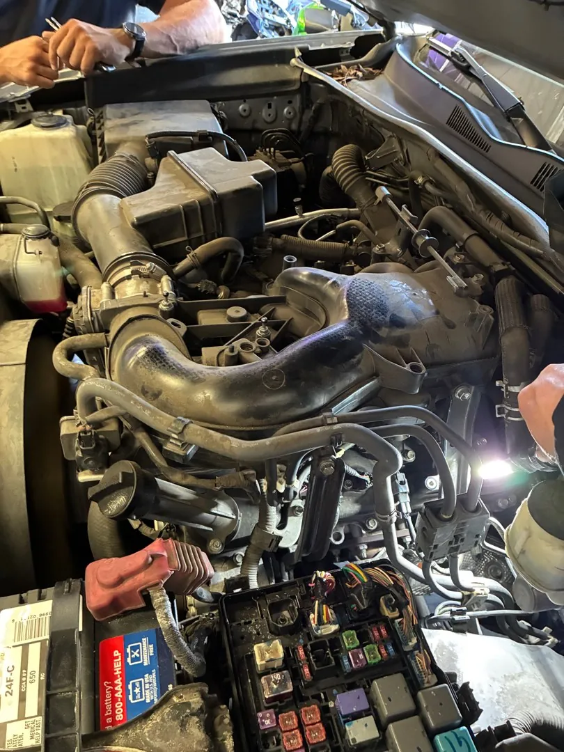 Deep in the engine bay.