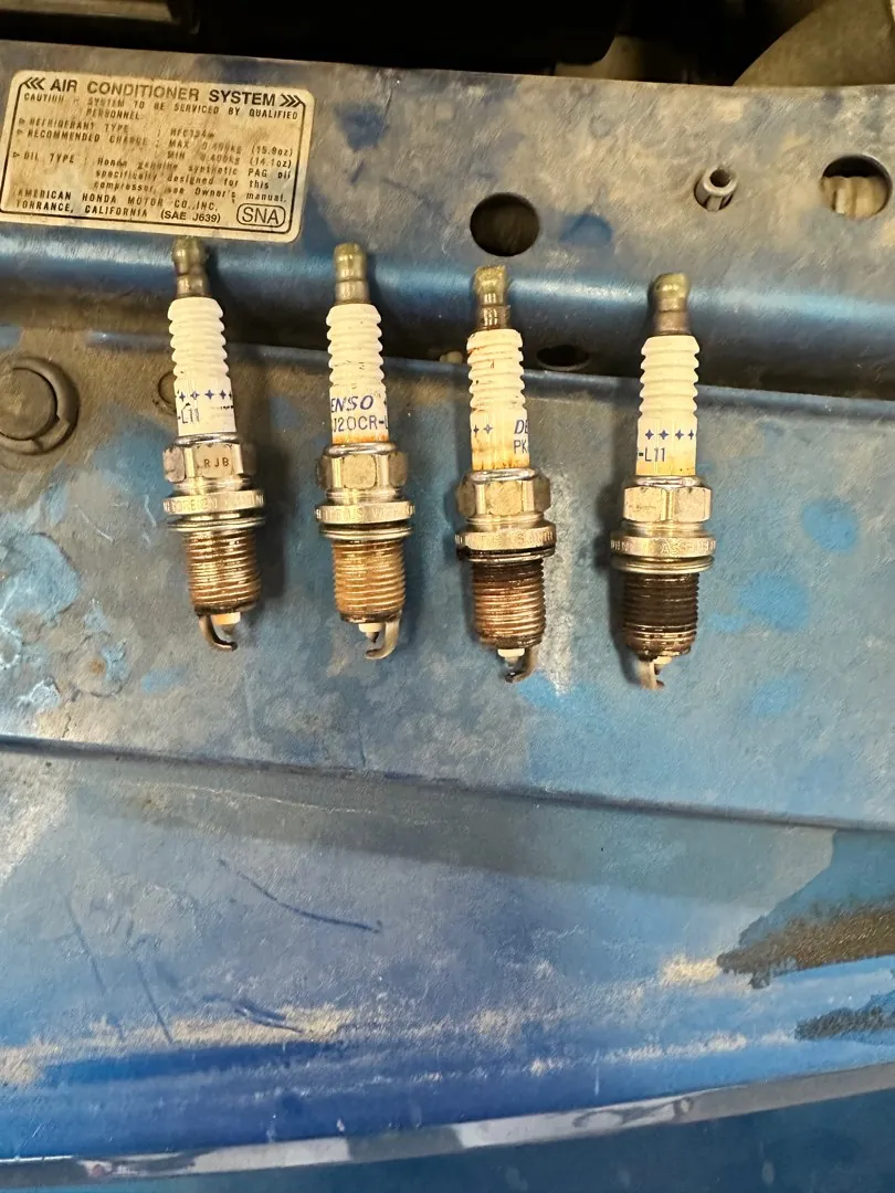 Four old plugs lined up.