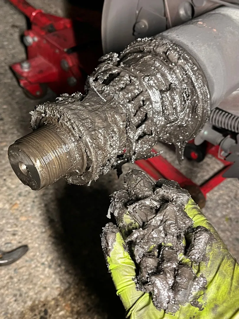 Heavy truck hub. Grease and dirt.